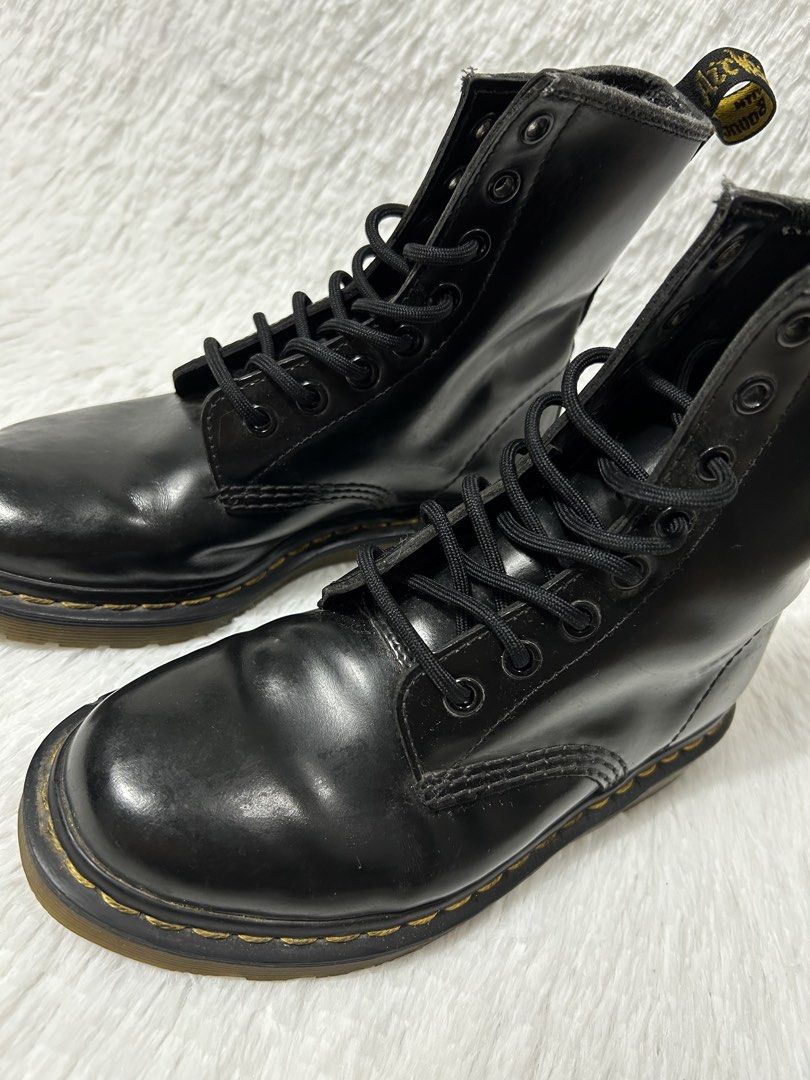 Dr. Martens 1460 Black Smooth Leather Boots (Category: Boots) located in Quezon City. Submitted by commonwealthpickerph (Listing ID 1468067486, Image 2). Description: - Brand: Dr. Martens - Style: Classic 8-eye boots in black leather - Details: Iconic yellow welt stitching, black laces, metal eyelets, and AirWair heel pull loops - Condition: Normal toe box creasing and standard sole wear from previous use, texture - Shipping or meetups available 