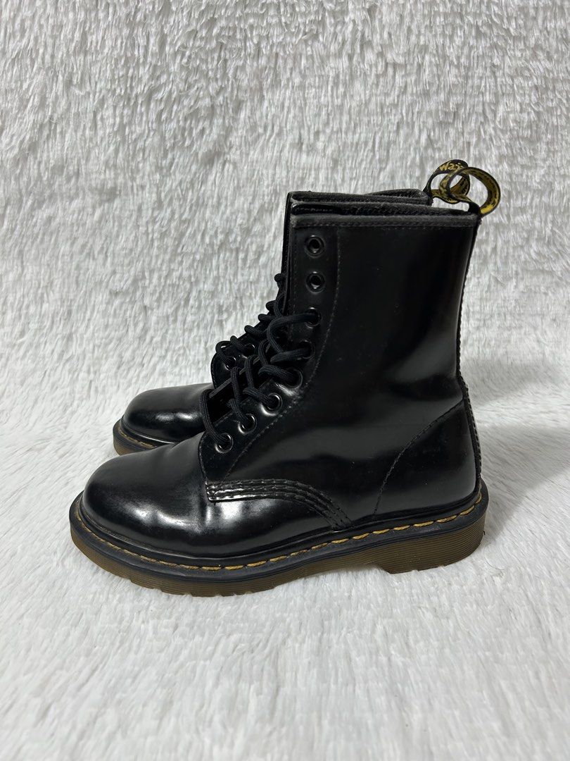 Dr. Martens 1460 Black Smooth Leather Boots (Category: Boots) located in Quezon City. Submitted by commonwealthpickerph (Listing ID 1468067486, Image 3). Description: - Brand: Dr. Martens - Style: Classic 8-eye boots in black leather - Details: Iconic yellow welt stitching, black laces, metal eyelets, and AirWair heel pull loops - Condition: Normal toe box creasing and standard sole wear from previous use, texture - Shipping or meetups available 