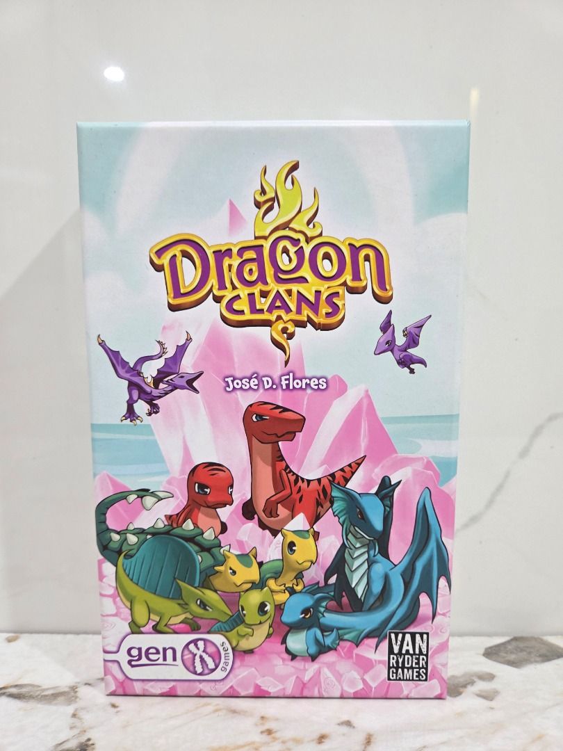 Dragon Clans Board Game by Van Ryder Games (Category: Board Games & Puzzles) located in Caloocan City. Submitted by caiwilmer (Listing ID 1468181162, Image 2). Description: Dragon Clans — Card & Dice Game (Van Ryder Games / Gen X Games) Dragon Clans by José D. Flores! A fun, push-your-luck card and dice game where players compete to breed, evolve, and train the most valuable dragons. "Have you ever wished you had a dragon as a pet? Roll dice up t