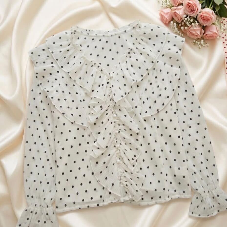 Dreamy Vintage-inspired Polka dot Blouse (Category: Blouses) located in Manila. Submitted by elyvelleee (Listing ID 1468251265, Image 1). Description: A dreamy vintage-inspired polka dot blouse for our coquette girlies! 🎀🤍 Featuring delicate layered ruffles, dainty buttons, and cute flared cuffs for that soft, romantic aesthetic. ♡ Classic polka dot print ♡ Beautiful layered ruffle details ♡ Feminine long sleeves with ruffled cuffs ♡ Perfect fo