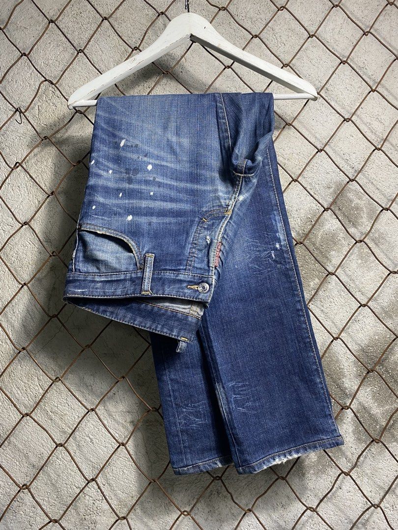 Dsquared Distressed Paint Splatter Denim Jeans Size 48 (Category: Jeans) located in Cabanatuan. Submitted by adrialesdrip (Listing ID 1468216320, Image 1). Description: - Authentic Dsquared2 designer denim jeans - Size: 48 (Made in Italy) - Medium blue wash with trendy distressed finish - Unique white paint splatter details across the front - Classic button fly closure with branded hardware - Signature red logo tab detail Measurements W 34 L 39.5