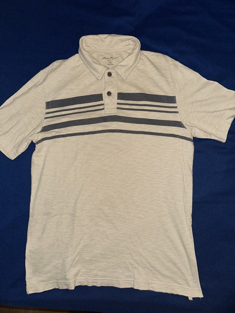 Eddie Bauer Polo shirt (Category: Tshirts & Polo Shirts ) located in Quezon City. Submitted by mancave_stuff (Listing ID 1468182363, Image 1). Description: Eddie Bauer Polo shirt short sleeve Size M: 29” x 29” Color rate: 9/10 Beige with brown stripes Very Good condition No issues.