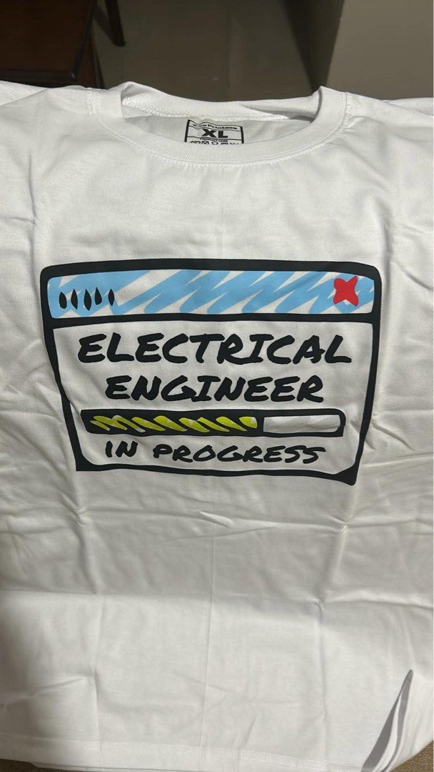 Electrical Engineering white t-shirt (Category: Tshirts & Polo Shirts ) located in Manila. Submitted by whatnotshop (Listing ID 1468132029, Image 1). Description: - Color: White - Size: XL - Design: 'Electrical Engineer in Progress' graphic print - Condition: Brand new 📍Quezon City.