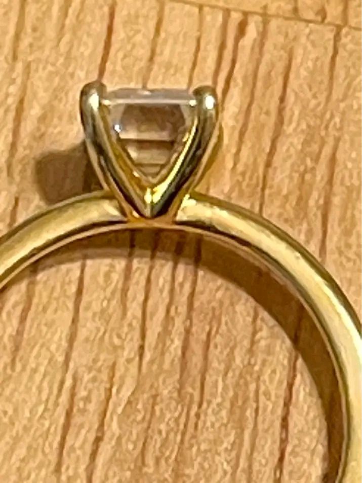Emerald Cut Diamond Ring Gold Band (Category: Rings) located in Pagadian. Submitted by mamithere (Listing ID 1468107954, Image 2). Description: - Elegant minimalist design with a thin yellow gold band - Stunning rectangular emerald-cut stone in a secure four-prong setting - Clean, highly polished metal finish with a clear, light-reflecting gemstone - Includes a premium wooden presentation box featuring a cream velvet interior slot - Perfect for g