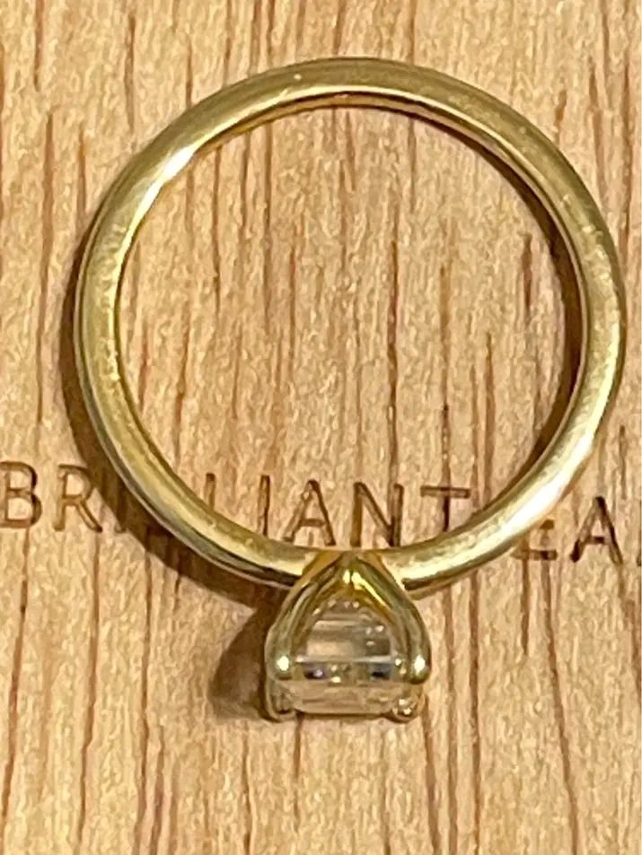 Emerald Cut Diamond Ring Gold Band (Category: Rings) located in Pagadian. Submitted by mamithere (Listing ID 1468107954, Image 3). Description: - Elegant minimalist design with a thin yellow gold band - Stunning rectangular emerald-cut stone in a secure four-prong setting - Clean, highly polished metal finish with a clear, light-reflecting gemstone - Includes a premium wooden presentation box featuring a cream velvet interior slot - Perfect for g