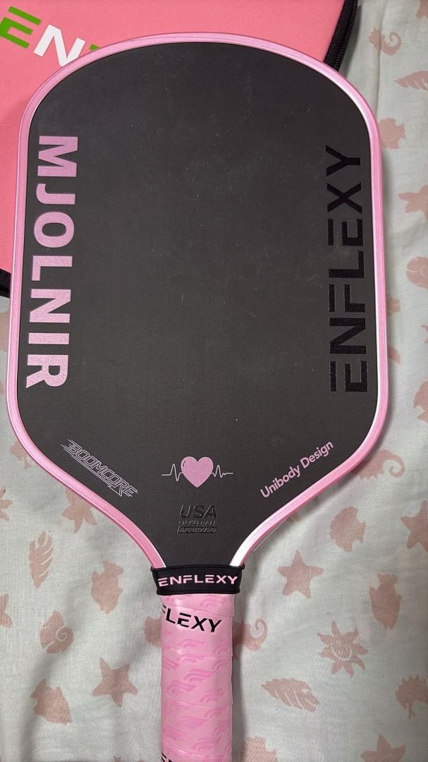 Enflexy Mjolnir Pink Edition (Category: Racket and Ball Sports) located in Trece Martires City. Submitted by leilei2 (Listing ID 1468218831, Image 3). Description: Complete with box. Edge Tape installed since day 1 and thrice lang siya nagamit. Pref meet up para macheck mismo unit.