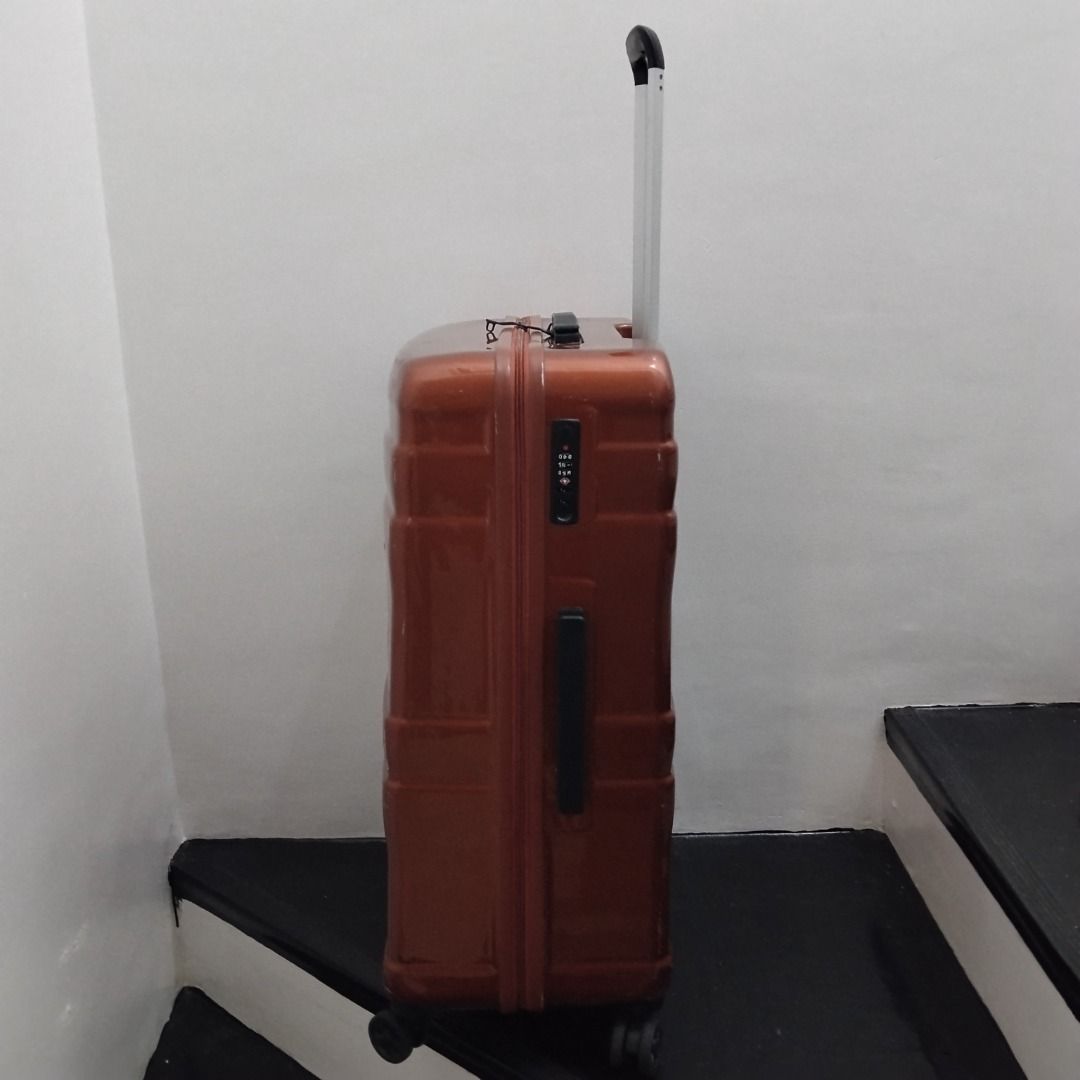 EPIC Bronze Hard Shell Rolling Luggage Suitcase (Category: Luggage) located in Cavite. Submitted by msgs_2827 (Listing ID 1468115781, Image 3). Description: For Sale: EPIC 28 inch Luggage with TSA Lock Color: Bronze Condition: Only used once - in very good condition! Actual Measurements (including the wheels): Height: 29 inches Width: 20 inches Depth: 11 inches - Color/Finish: Glossy bronze with stylish horizontal ribbed detailing - Size: Large h
