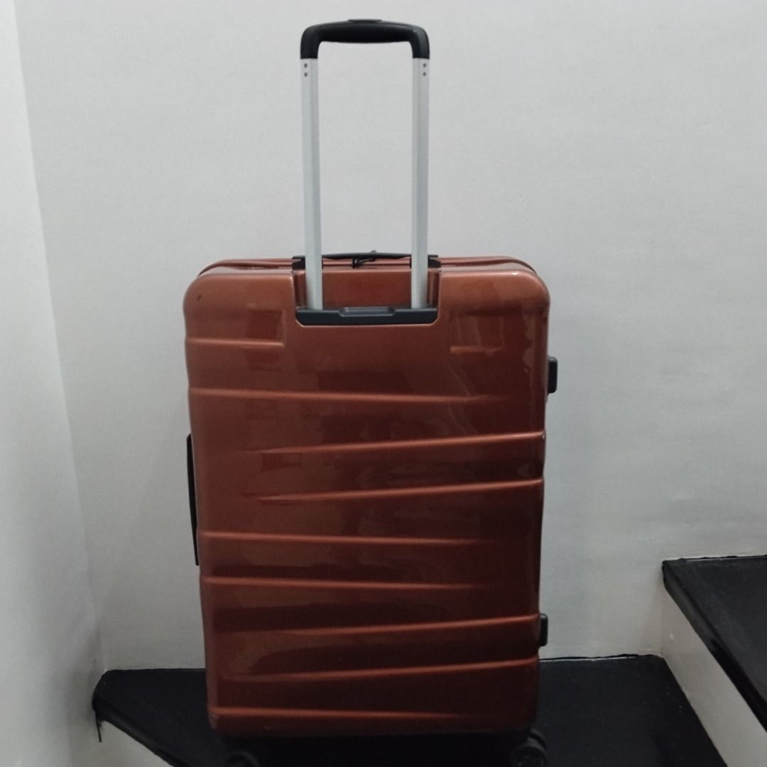 EPIC Bronze Hard Shell Rolling Luggage Suitcase (Category: Luggage) located in Cavite. Submitted by msgs_2827 (Listing ID 1468115781, Image 2). Description: For Sale: EPIC 28 inch Luggage with TSA Lock Color: Bronze Condition: Only used once - in very good condition! Actual Measurements (including the wheels): Height: 29 inches Width: 20 inches Depth: 11 inches - Color/Finish: Glossy bronze with stylish horizontal ribbed detailing - Size: Large h