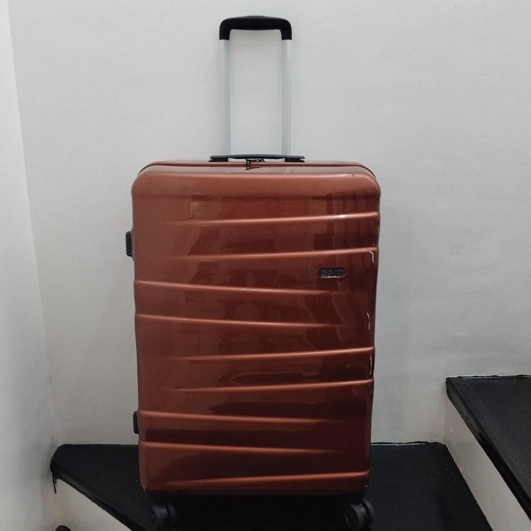 EPIC Bronze Hard Shell Rolling Luggage Suitcase (Category: Luggage) located in Cavite. Submitted by msgs_2827 (Listing ID 1468115781, Image 1). Description: For Sale: EPIC 28 inch Luggage with TSA Lock Color: Bronze Condition: Only used once - in very good condition! Actual Measurements (including the wheels): Height: 29 inches Width: 20 inches Depth: 11 inches - Color/Finish: Glossy bronze with stylish horizontal ribbed detailing - Size: Large h