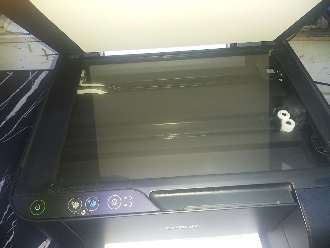 Epson L3110 All-in-One Ink Tank Printer (Category: Printers, Scanners & Copiers) located in Manila. Submitted by haydsryde (Listing ID 1468177743, Image 2). Description: - Model: Epson L3110 (Black) - Functions: Print, scan, and copy with an efficient integrated ink tank system - Condition: Fully tested and 100% operational - Inclusions: Power cable in plastic and a test print page showing clear alignment - Authenticity: Serial number tag intact 