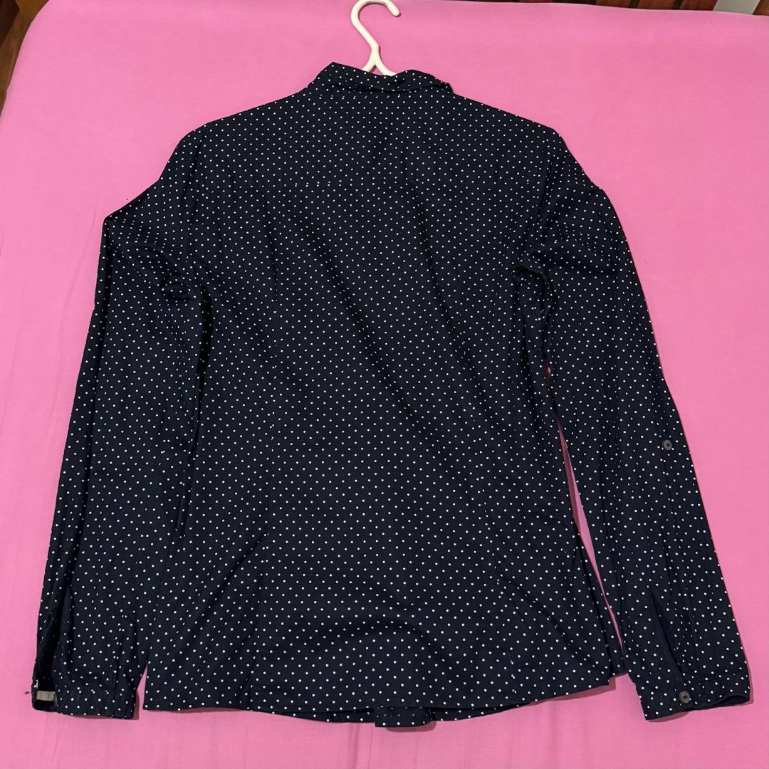 Esprit Navy Blue Polka Dot Long Sleeve (Category: Blouses) located in San Fernando. Submitted by declotter (Listing ID 1468083440, Image 2). Description: - Brand: Esprit - Color: Navy blue with white polka dots - Size: UK 10, US 6, D 36 - Style: Long sleeves with button closures, button-up front - Versatile piece ideal for work or casual outings .