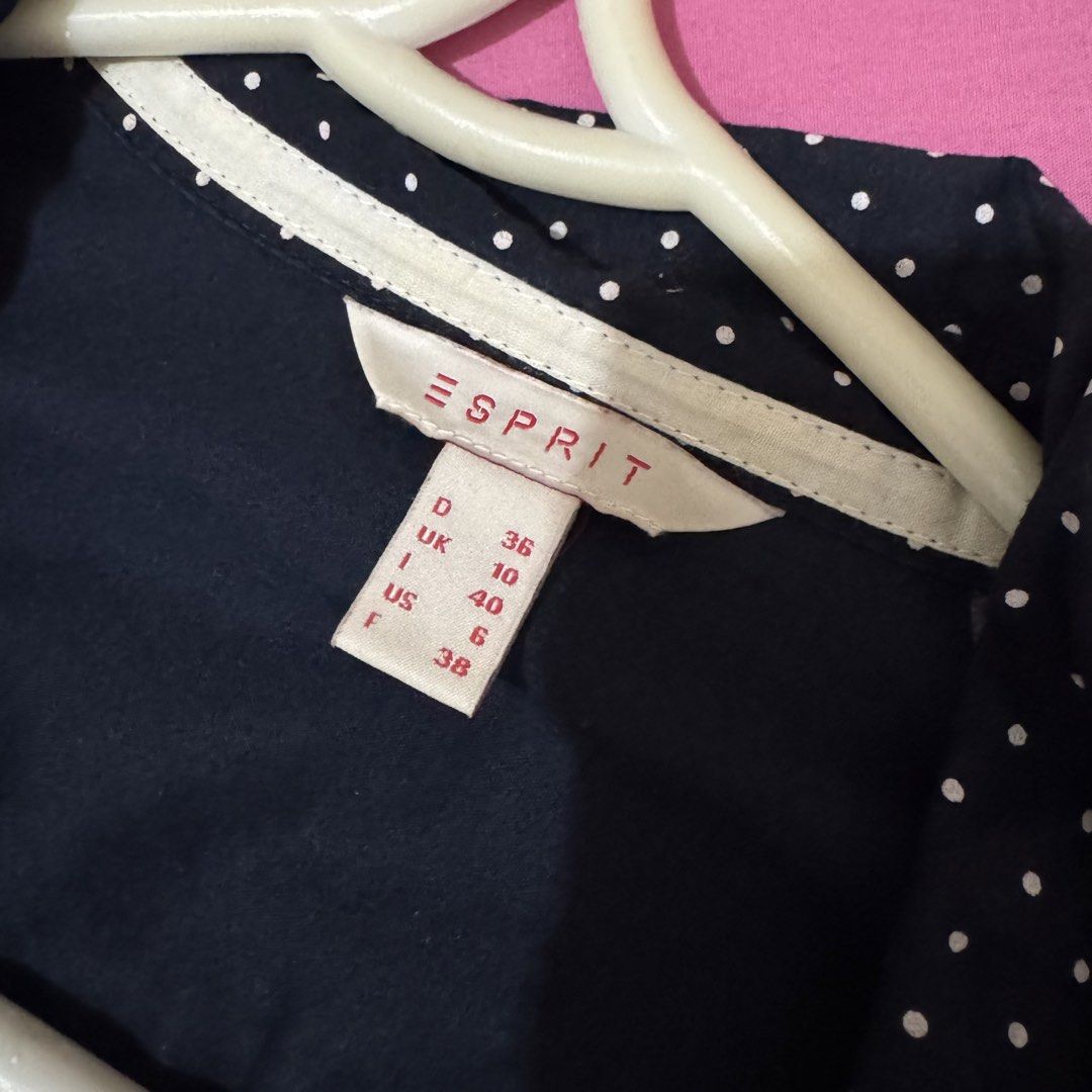 Esprit Navy Blue Polka Dot Long Sleeve (Category: Blouses) located in San Fernando. Submitted by declotter (Listing ID 1468083440, Image 3). Description: - Brand: Esprit - Color: Navy blue with white polka dots - Size: UK 10, US 6, D 36 - Style: Long sleeves with button closures, button-up front - Versatile piece ideal for work or casual outings .
