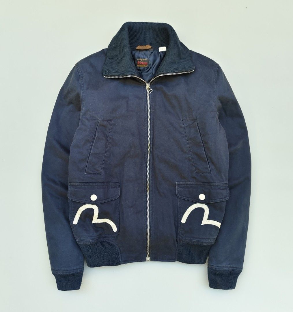 EVISU bomber jacket (filler quilted lining) (Category: Coats, Jackets and Outerwear) located in Baguio. Submitted by archival_thrifted.ph. (Listing ID 1468138711, Image 1). Description: FOR SALE‼️ .EVISU BOMBER JACKET .EXCELLENT CONDITION .QUILTED FILLER LINING .W/NORMAL SIGNS OF USAGE .MEDIUM ON TAG .PHP 2800 PLUS SF .❌❌ COP/COD .MOP GCASH .COURIER J&T .BAGUIO AREA .DM FOR SURE BUYER TY.