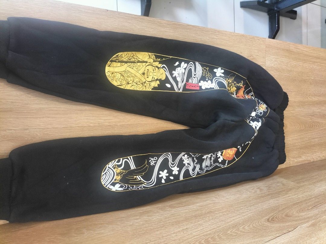 Evisu Heritage Black Sweatpants Size 140 (Category: Joggers) located in Manila. Submitted by patriciab12636 (Listing ID 1468227478, Image 1). Description: - fir kids size 24 lenth 30inches Brand: Evisu Heritage - Color: Black with gold and white graphics - Size: Tagged size 140 - Design: Striking leg prints with small gold gull logo near the hip - Fit: Elastic waistband and ribbed ankle cuffs - Condition: Clean fabric with bright, un-faded graphi