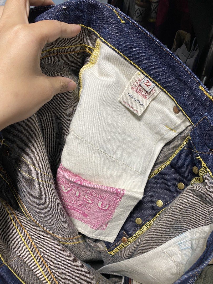 Evisu Selvedge Jeans (Category: Jeans) located in Mangatarem. Submitted by juicybabe_ (Listing ID 1468244846, Image 3). Description: - Size: 32 - Fit: Straight leg cut - Material: 100% cotton - Details: Painted pink and purple gull wings on back pockets, yellow contrast stitching, leather patch on back waistband - Closure: Button fly.