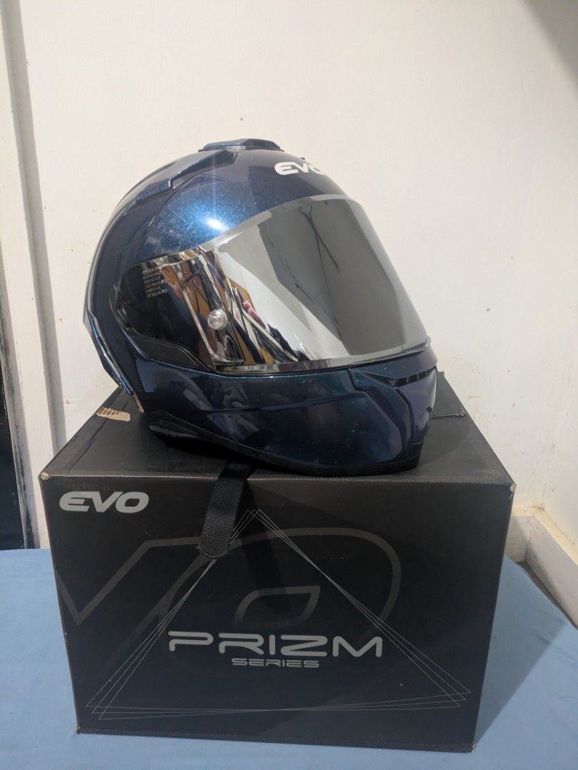 EVO Prizm Series Full Face Helmet (M) (Category: Helmets and other Riding Gears) located in Bocaue. Submitted by _agentorange (Listing ID 1468085278, Image 2). Description: EVO Prizm series motorcycle helmet in Prizm Sapphire finish. Mirrored visor attached, plus an extra clear, anti-scratch visor in the box. Clean interior padding with red trim detail. Quick-release strap buckle. DOT Certified, Dura-flex washable foamset. Aerodynamic vents. ABS 