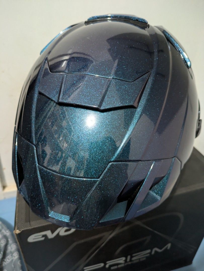 EVO Prizm Series Full Face Helmet (M) (Category: Helmets and other Riding Gears) located in Bocaue. Submitted by _agentorange (Listing ID 1468085278, Image 3). Description: EVO Prizm series motorcycle helmet in Prizm Sapphire finish. Mirrored visor attached, plus an extra clear, anti-scratch visor in the box. Clean interior padding with red trim detail. Quick-release strap buckle. DOT Certified, Dura-flex washable foamset. Aerodynamic vents. ABS 