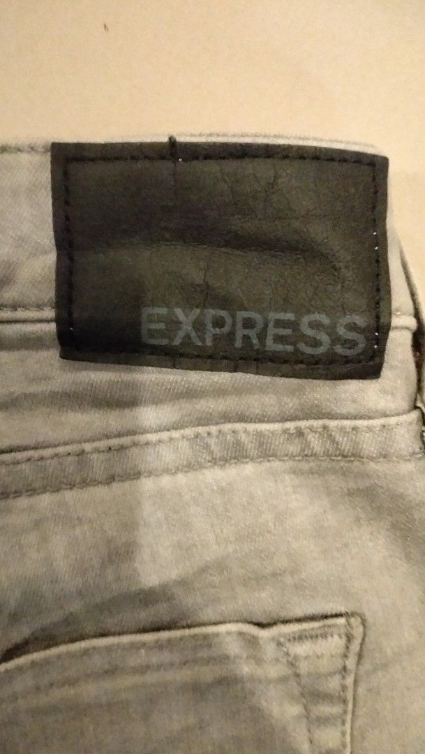 Express Hyper Stretch Slim Jeans Grey 36x34 (Category: Jeans) located in Angeles City. Submitted by mightywhale_13072f (Listing ID 1468175993, Image 3). Description: - Brand: Express - Style: Slim fit jeans - Color: Grey - Size: 36x34, actual w36.L44 - Material: Hyper stretch fabric for extra comfort - Closure: zipper - Features: Classic five-pocket design and black leather back patch with Express branding - Origin: Made in Pakistan.