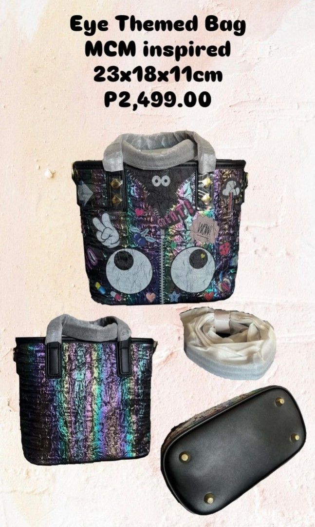 Eye Themed Bag MCM Inspired (Category: Luxury Bags & Wallets) located in Marikina City. Submitted by savemyclosetph (Listing ID 1468241643, Image 2). Description: Eye themed bag, MCM inspired design. Iridescent finish with multi-colored patches, zipper detail down the center, and large cartoon eyes near the bottom. Dual top handles and included adjustable shoulder strap. Protective metal feet on the bottom base. Dimensions measure 23 by 18 by 11 