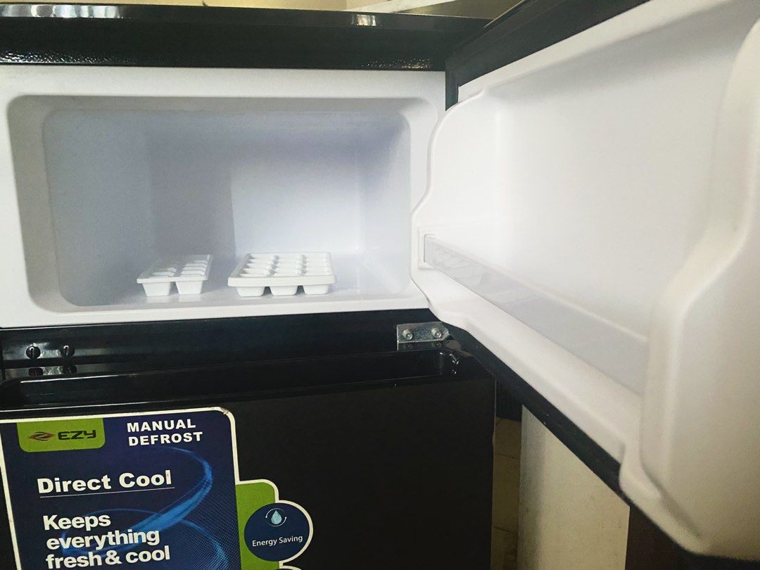 EZY 2-Door Personal Refrigerator / Mini Fridge (Category: Refrigerators and Freezers) located in Las Pinas. Submitted by eelllla026 (Listing ID 1468130519, Image 2). Description: RFS: Need urgent cash Key Features & Highlights Brand: EZY Type: 2-Door Personal Refrigerator / Direct Cool Color: Dark Gray / Charcoal Finish Freezer: Dedicated Top Freezer Compartment Features: Energy-saving, low noise, interior LED lighting, and manual defrost system.
