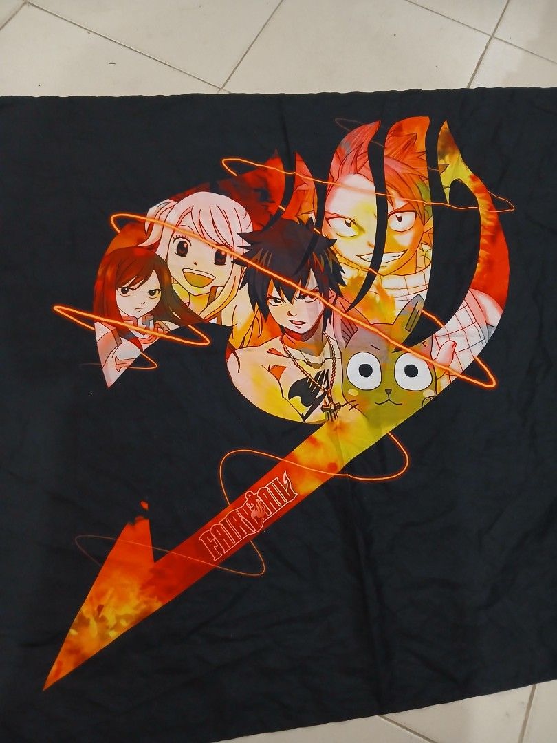 Fairy Tail Anime Wall Tapestry Black Background (Category: Wall Decor) located in Daraga. Submitted by thethriftcity2024 (Listing ID 1468105059, Image 2). Description: - Design: Features Natsu, Lucy, Gray, Happy, and Erza inside the iconic Fairy Tail guild symbol - Material: 100% durable polyester with vibrant print quality against a sleek black background - Size: Standard one-size (as labeled on tag) - Perfect for: Bedroom, dorm room, or anime-t