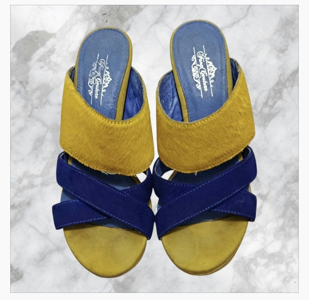 Fang Couture Blue and Yellow Platform Heels (Category: Heels) located in Paranaque City. Submitted by calm_youngstore7 (Listing ID 1468090796, Image 2). Description: - Brand: Fang Couture - Style: Chunky block heel platform sandals - Colorway: Blue and yellow - Materials: Textured yellow upper strap and blue suede crossover straps - Details: Blue branded insole Tang Couture platform mules These shoes are vibrant, color-blocked platform mules feat