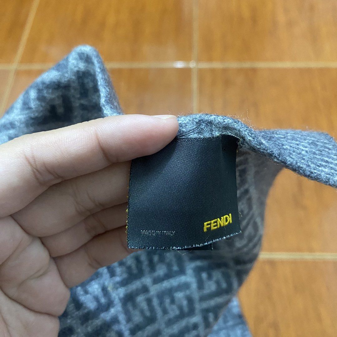 Fendi FF Zucca Wool Scarf Grey (Category: Scarves) located in Naga. Submitted by ejdurante17 (Listing ID 1468223064, Image 3). Description: Grey wool scarf covered in the classic Fendi FF monogram pattern. Made in Italy, 100% wool material keeps you warm during cold weather. Includes original branding tags and hologram authentication patch attached at the end. Dry clean only. Classic designer winter accessory. NO ISSUE Negotiable MOP: Gcash / May