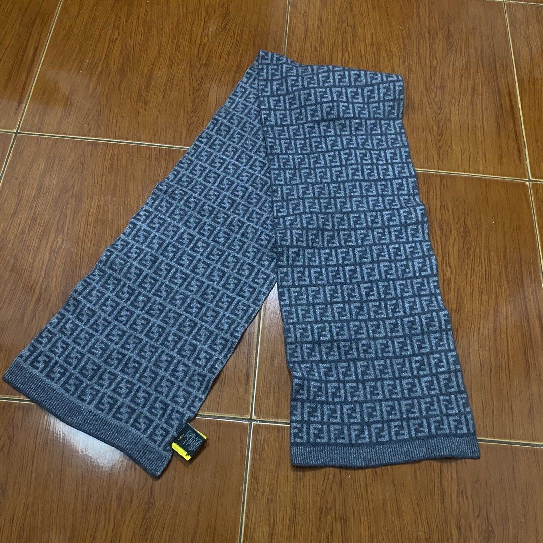 Fendi FF Zucca Wool Scarf Grey (Category: Scarves) located in Naga. Submitted by ejdurante17 (Listing ID 1468223064, Image 2). Description: Grey wool scarf covered in the classic Fendi FF monogram pattern. Made in Italy, 100% wool material keeps you warm during cold weather. Includes original branding tags and hologram authentication patch attached at the end. Dry clean only. Classic designer winter accessory. NO ISSUE Negotiable MOP: Gcash / May