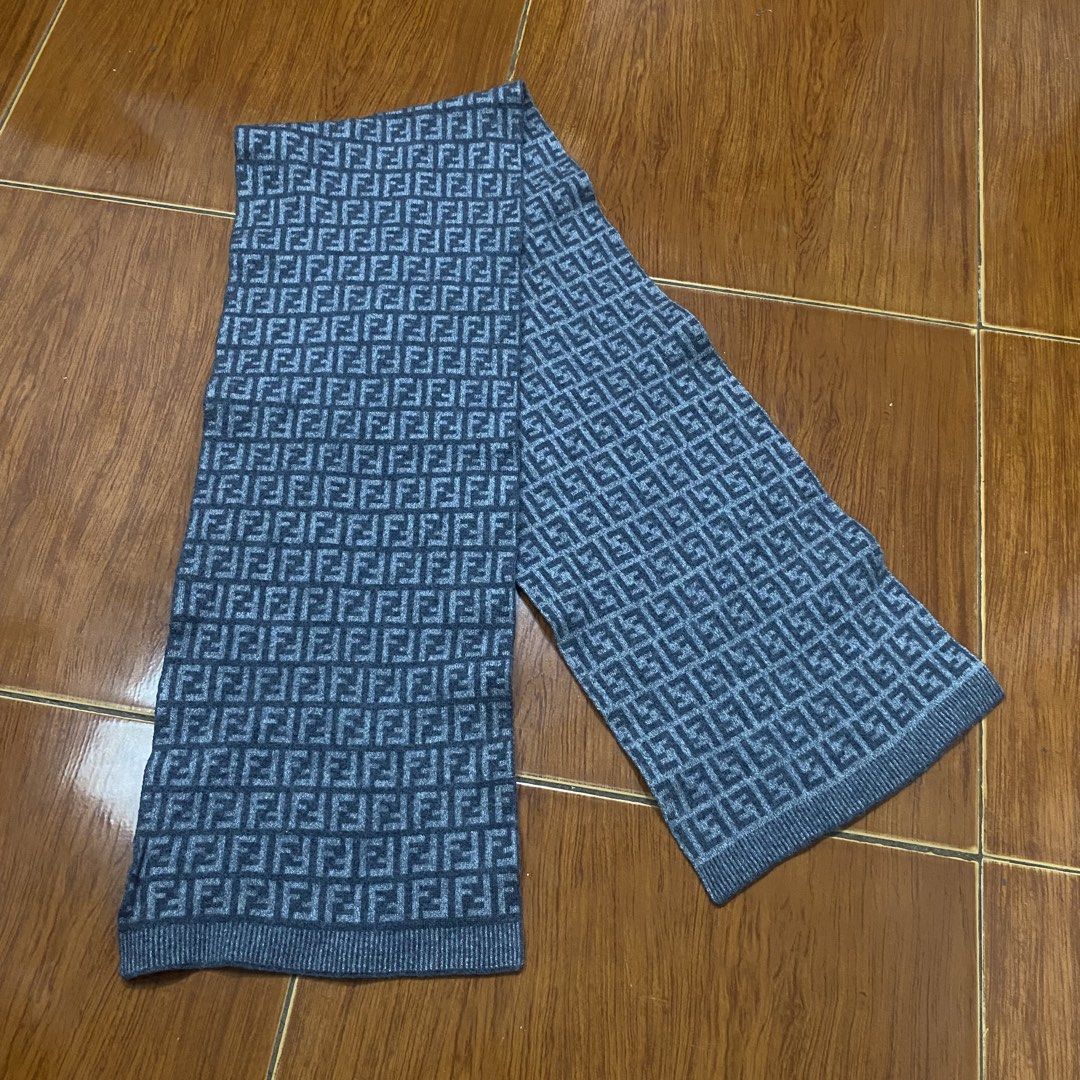 Fendi FF Zucca Wool Scarf Grey (Category: Scarves) located in Naga. Submitted by ejdurante17 (Listing ID 1468223064, Image 1). Description: Grey wool scarf covered in the classic Fendi FF monogram pattern. Made in Italy, 100% wool material keeps you warm during cold weather. Includes original branding tags and hologram authentication patch attached at the end. Dry clean only. Classic designer winter accessory. NO ISSUE Negotiable MOP: Gcash / May