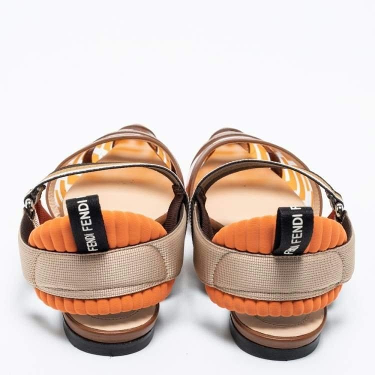 Fendi Transparent Orange Brown Pointed Toe Slingback Flats (Category: Flats & Sandals) located in Paranaque City. Submitted by calm_youngstore7 (Listing ID 1468066425, Image 2). Description: - Brand: Fendi - Style: Pointed toe flats with flat heel - Design: Transparent clear vinyl front with iconic monogram check print in orange and brown - Details: Leather trim, striped elasticated slingback strap, and cushioned heel collar with Fendi logo pull 