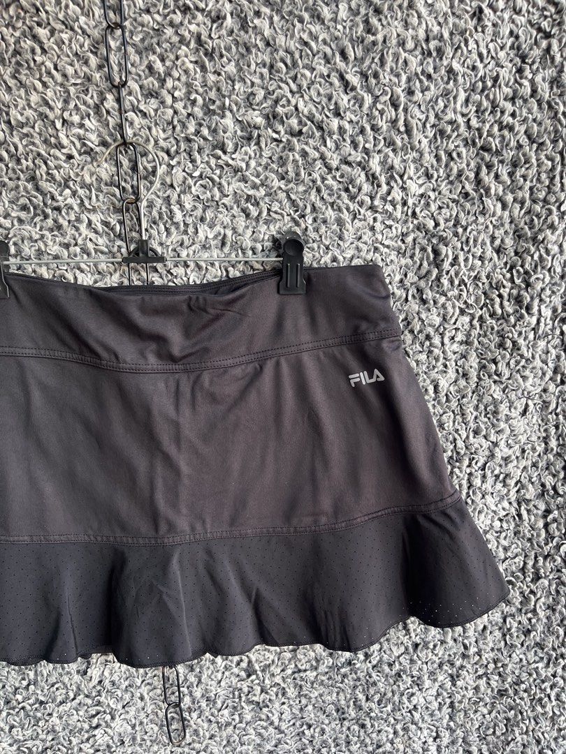 FILA athletic tennis skort | Size L (Category: Skirts) located in General Trias. Submitted by zrchustle.604 (Listing ID 1468279066, Image 3). Description: FILA athletic tennis skort featuring a wide waistband, a flounce/ruffle hem, and a silver FILA logo on the upper right side..