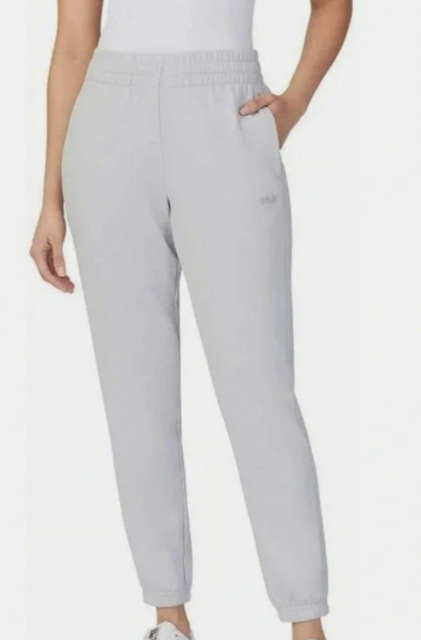 FILA Grey Sweatpants Joggers Size L (Category: Other Bottoms) located in Manila. Submitted by lene48 (Listing ID 1468106118, Image 1). Description: - Brand: Fila - Color: Grey - Size: L (UK 46/48, D 40) - Material: Comfortable fleece inside - Features: Elastic waistband, ribbed ankle cuffs, and small printed Fila logo - Condition: Clean and ready to wear.