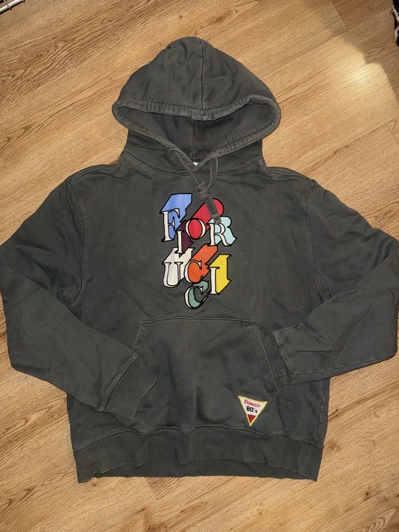FIORUCCI GRAPHIC HOODIE (Category: Coats, Jackets and Outerwear) located in Las Pinas. Submitted by coolthreadz (Listing ID 1468177873, Image 1). Description: 🖤 FIORUCCI GRAPHIC HOODIE 🏷️ Design: Fiorucci Multi-Color Logo & Poolside Graphic Hoodie 📏 Size: L 🎨 Color: Washed Charcoal / Dark Grey Bought in Makati Rockwell ✨ Details: * Classic drawstring hoodie with front kangaroo pocket * Front features a vibrant, multi-colored stacked "FIORUCCI