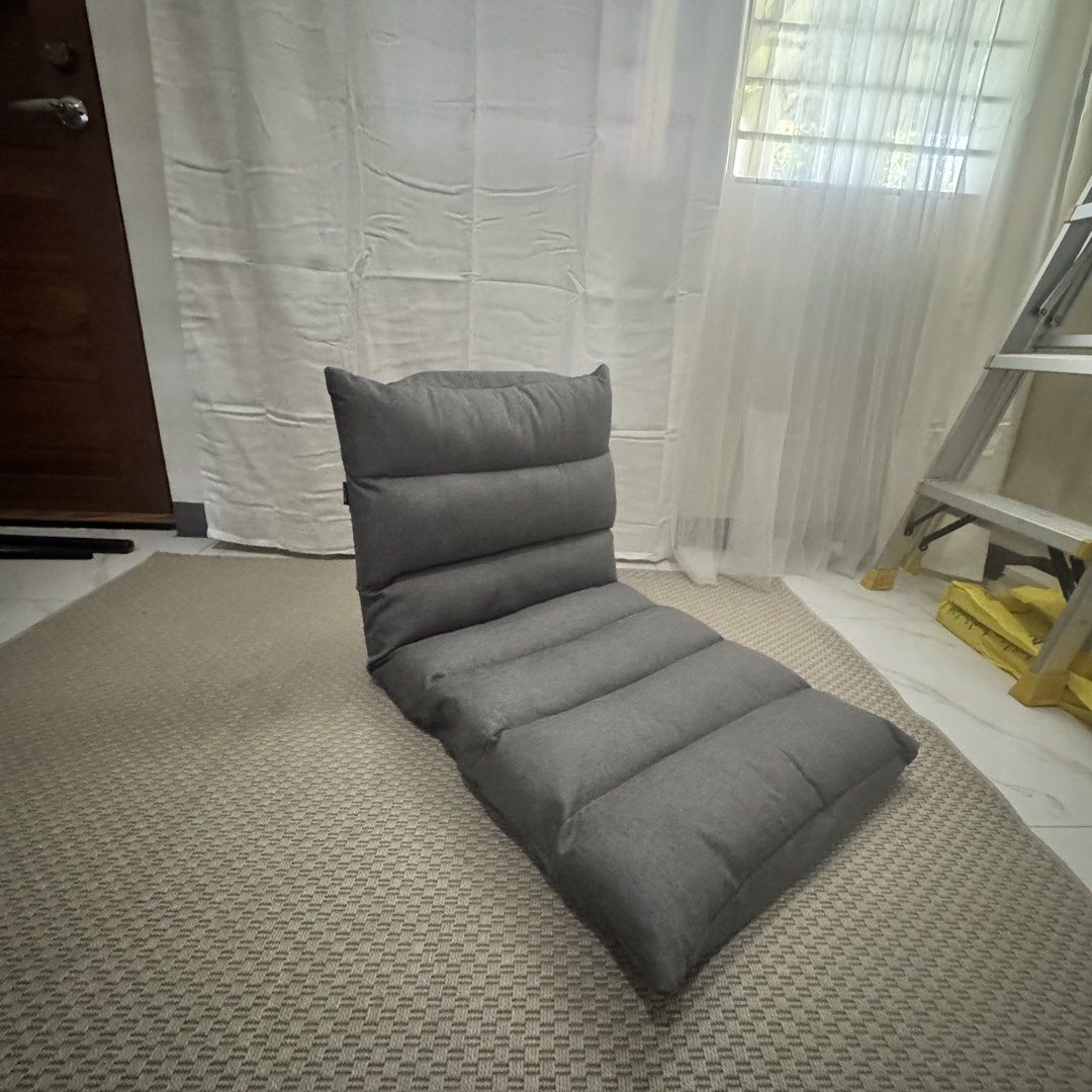 Floor Chair - Surplus (Category: Chairs) located in Marikina City. Submitted by repurpose_studio (Listing ID 1468107438, Image 1). Description: - Color: Neutral dark grey - Versatile design: Converts completely flat into a single mattress - Adjustable: Multi-adjustable backrest sections for custom seating angles - Comfort: Soft fabric upholstery with thick padded cushioning - Condition: Clean, well-maintained, and works smoothly with no issues re