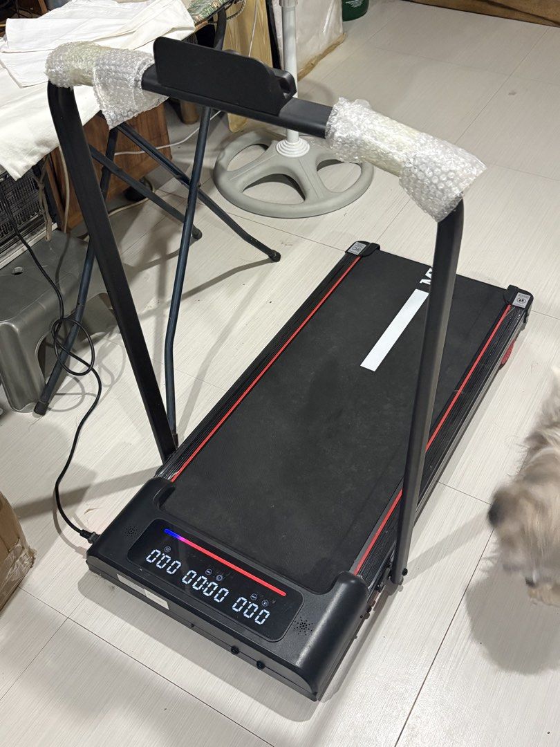Foldable Electric Walking Pad Treadmill 16KM (Category: Cardio & Fitness Machines) located in Manila. Submitted by luxurai (Listing ID 1468228995, Image 2). Description: - Foldable walking pad treadmill with app connectivity - Speed goes up to 16km/h - LED display shows speed, time, and calories - Handlebars still wrapped in original protective bubble wrap - Tested and fully working with clear digital console lights - Compact size and easy to sto