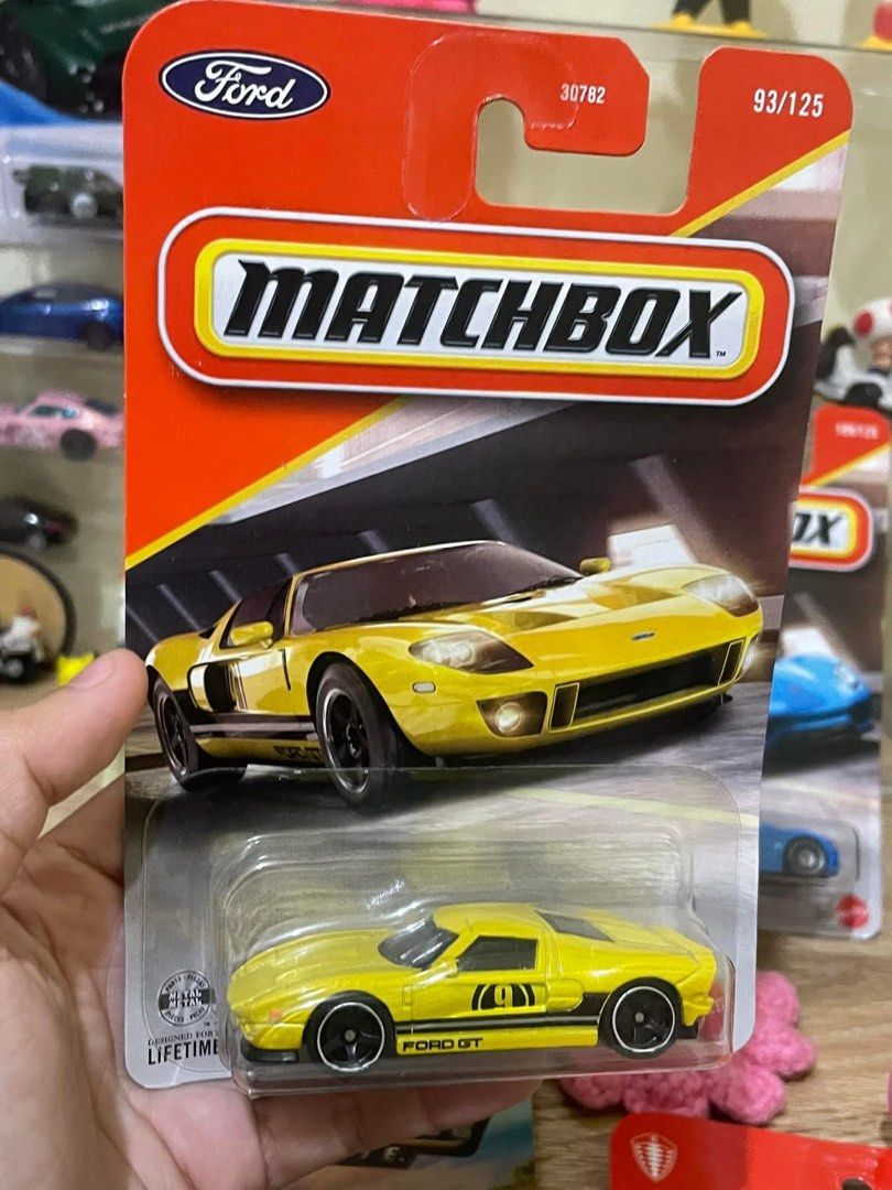 Ford GT Yellow 93/125 (Category: Vehicle & Diecast Models) located in Manila. Submitted by chelle_thrifted_shack (Listing ID 1468183229, Image 1). Description: - Brand: Matchbox - Model: Ford GT - Color: Bright yellow with black side stripes and #9 door graphic - Scale: Diecast model - Condition: Brand new, unopened card (Packaging No. 30782) with minor corner shelf wear - Perfect for: Diecast collectors and Ford sports car fans.