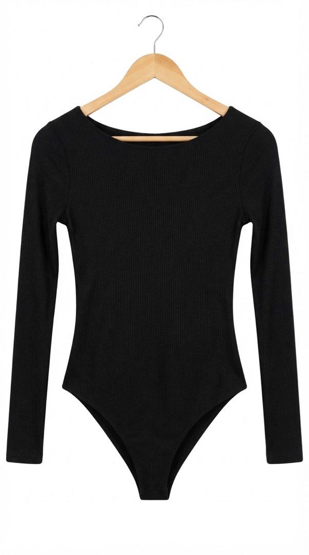 Forever 21 Black Ribbed Long Sleeve Bodysuit (Category: Longsleeves) located in Cavite. Submitted by grandearth.39df3f (Listing ID 1468125193, Image 2). Description: - Brand: Forever 21 - Color: Black - Style: Long sleeve bodysuit - Material: Soft ribbed knit fabric - Design: Scoop neckline on front and back - Closure: Snaps at the bottom - Perfect for layering with high-waist jeans or skirts.