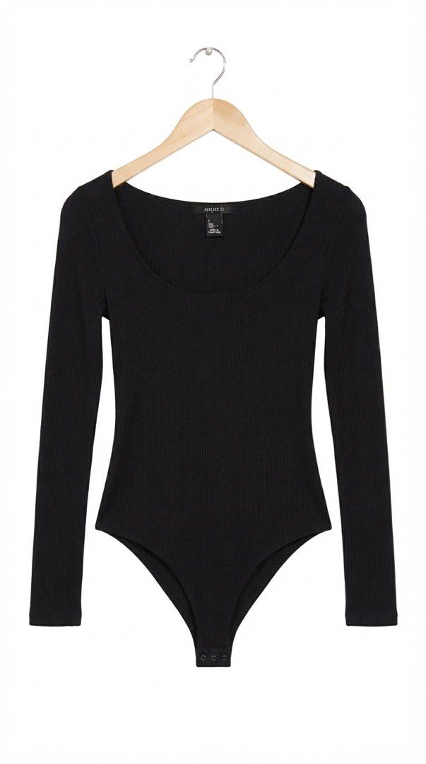 Forever 21 Black Ribbed Long Sleeve Bodysuit (Category: Longsleeves) located in Cavite. Submitted by grandearth.39df3f (Listing ID 1468125193, Image 1). Description: - Brand: Forever 21 - Color: Black - Style: Long sleeve bodysuit - Material: Soft ribbed knit fabric - Design: Scoop neckline on front and back - Closure: Snaps at the bottom - Perfect for layering with high-waist jeans or skirts.
