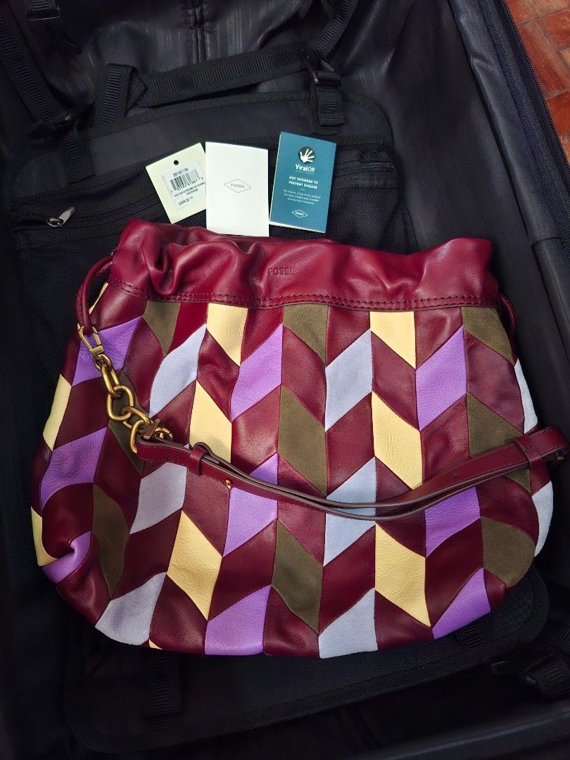 Fossil Gigi Shoulder Bag Patchwork (Category: Shoulder Bags) located in Pasig City. Submitted by bolddeer_2ab1c6 (Listing ID 1468222305, Image 1). Description: - Brand: Fossil Gigi Shoulder Bag - Condition: Brand new with tags (BNWT) and original packaging - Design: Vibrant multicolor leather patchwork (shades of purple, red, yellow, and green) - Details: Gold-tone hardware and adjustable shoulder strap - Retail Price: $389 CAD - Perfect pop of c