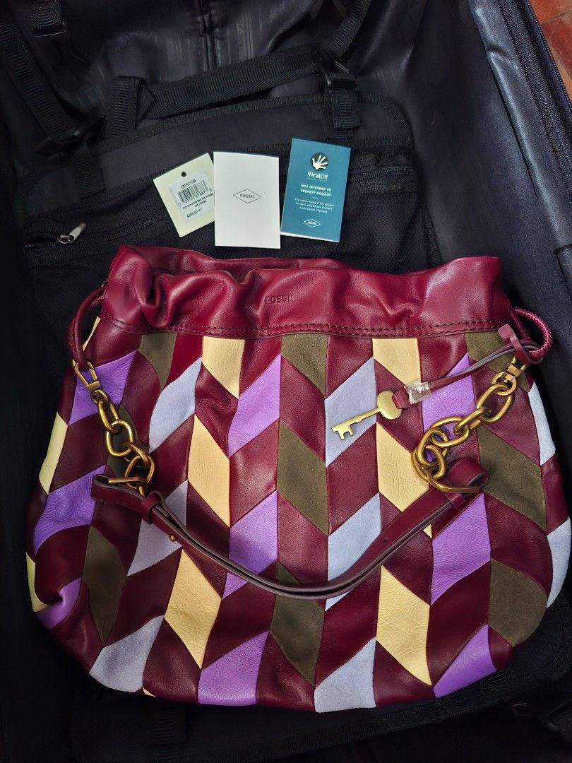 Fossil Gigi Shoulder Bag Patchwork (Category: Shoulder Bags) located in Pasig City. Submitted by bolddeer_2ab1c6 (Listing ID 1468222305, Image 2). Description: - Brand: Fossil Gigi Shoulder Bag - Condition: Brand new with tags (BNWT) and original packaging - Design: Vibrant multicolor leather patchwork (shades of purple, red, yellow, and green) - Details: Gold-tone hardware and adjustable shoulder strap - Retail Price: $389 CAD - Perfect pop of c