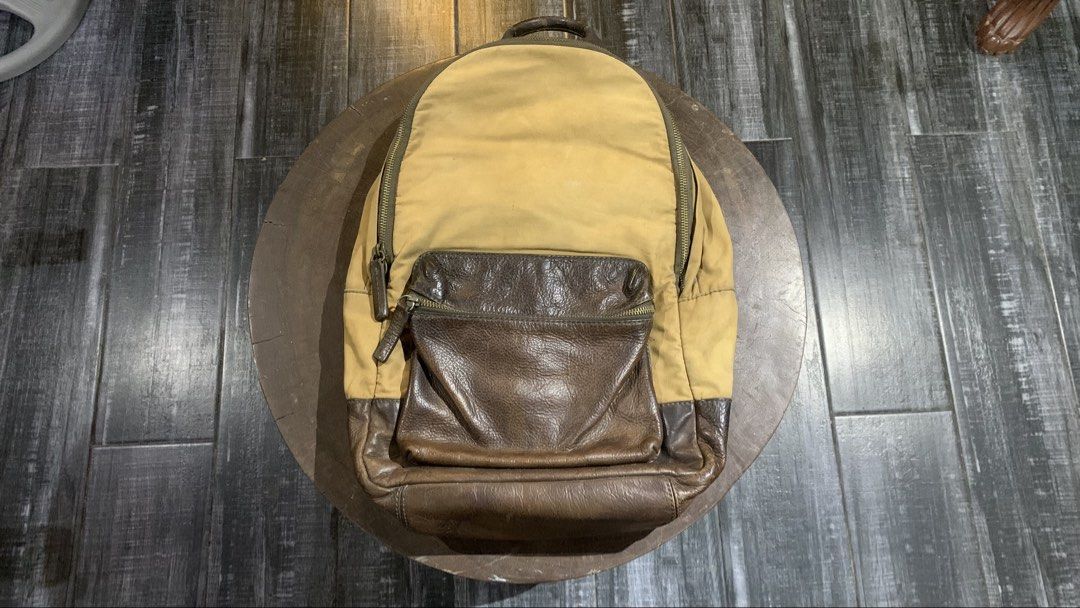 Fossil Leather and Canvas Backpack (Category: Backpacks) located in Santa Cruz, Pampanga. Submitted by vincent_2002 (Listing ID 1468065966, Image 2). Description: Selling an authentic Fossil genuine leather & canvas backpack in a classic vintage tan and dark espresso brown colorway. Key Features: Brand: Fossil (100% Authentic) Material: Heavy-duty canvas body with genuine leather front pocket, base, top handle, and shoulder straps Color: Tan / Kh