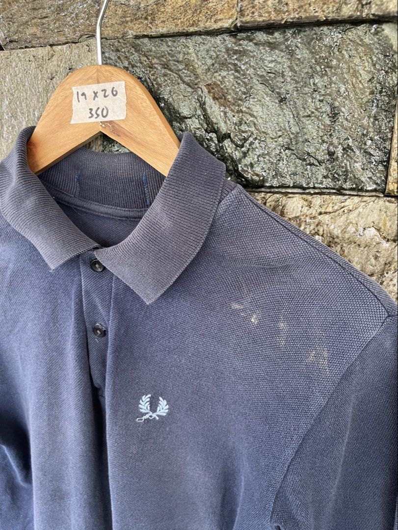 Fred Perry Navy Blue (Category: Tshirts & Polo Shirts ) located in Cagayan de Oro. Submitted by curatedheirloomph_ (Listing ID 1468117128, Image 2). Description: 𝘿𝙞𝙢𝙚𝙣𝙨𝙞𝙤𝙣𝙨: 19x26 𝘽𝙚𝙨𝙩 𝙁𝙞𝙩: Small - Medium 𝘾𝙤𝙣𝙙𝙞𝙩𝙞𝙤𝙣 & 𝘾𝙤𝙡𝙤𝙧 𝙍𝙖𝙩𝙚: Good (8.5/10) 𝙄𝙨𝙨𝙪𝙚: Missing tags, stain.