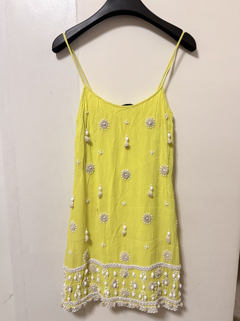 French Connection beaded mini dress size M (Category: Dresses) located in San Pablo. Submitted by iamtrina (Listing ID 1468238644, Image 3). Description: 32” length from top of strap 24” length from neckline down Flaw: tolerable 2 holes on the front but barrely noticeable because it’s only on the upper fabric, lining is the same color as the upper fabric Fits xs-S Bust up to 28” Waist up 26” Hips up to 32”.