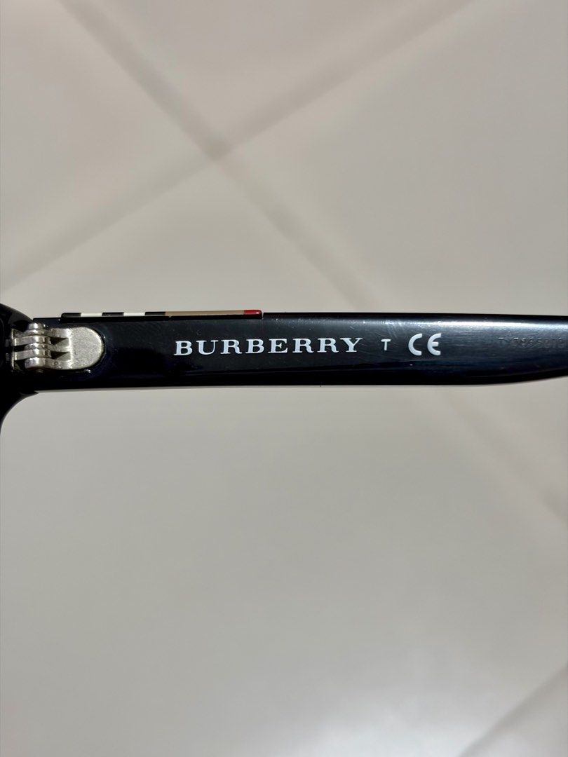 FS : Authentic Burberry prescription eyeglasses (black frame) (Category: Sunglasses & Eyewear) located in Quezon City. Submitted by baessist_z (Listing ID 1468178685, Image 3). Description: FS : Authentic Burberry prescription eyeglasses (black frame) Meetups : SM Fairview or Trinoma/SM North. Burberry optical frames, model B 2144 3001. Black acetate construction. Classic Burberry check pattern detail on the temples. Size 53-16-140. Includes orig