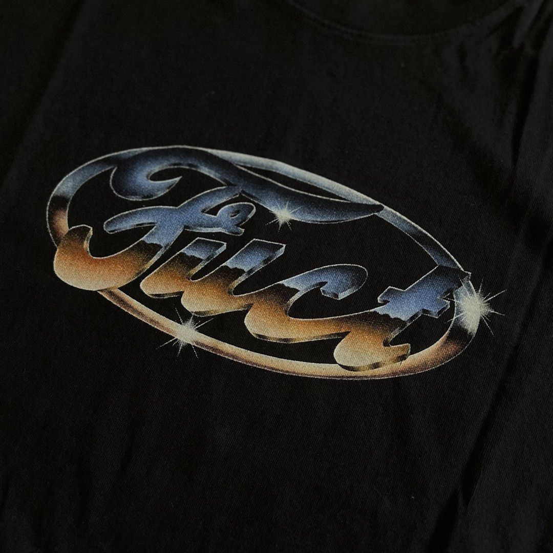 FUCT Chrome T-Shirt L (Category: Tshirts & Polo Shirts ) located in Taguig. Submitted by groovez_jp (Listing ID 1468096664, Image 1). Description: - Brand: FUCT - Color: Black - Size: Large (Classic fit) - Design: Chrome Ford-style logo with sparkle accents across the chest - Material: 100% pre-shrunk heavyweight cotton - Origin: Made in U.S.A. - Condition: Clean, no holes, no stains.