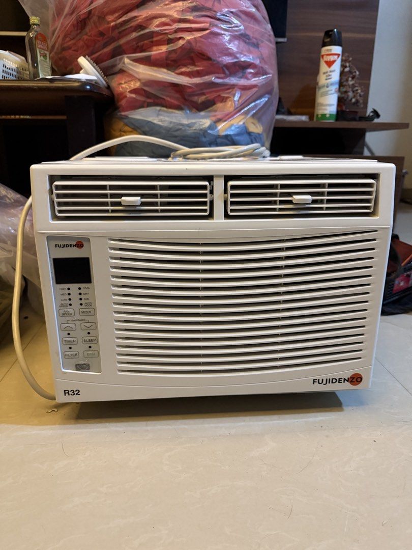 Fujidenzo R32 Window Type Air Conditioner (Category: Air Conditioning and Heating) located in Manila. Submitted by wise_pocholoremill (Listing ID 1468071797, Image 1). Description: - Brand: Fujidenzo Window Type Air Conditioner - Color: White - Refrigerant: Eco-friendly R32 model - Controls: Digital panel with fan speed, timer, sleep mode, and eco settings - Features: Adjustable top louvers and attached power cord - Condition: Clean front panel w