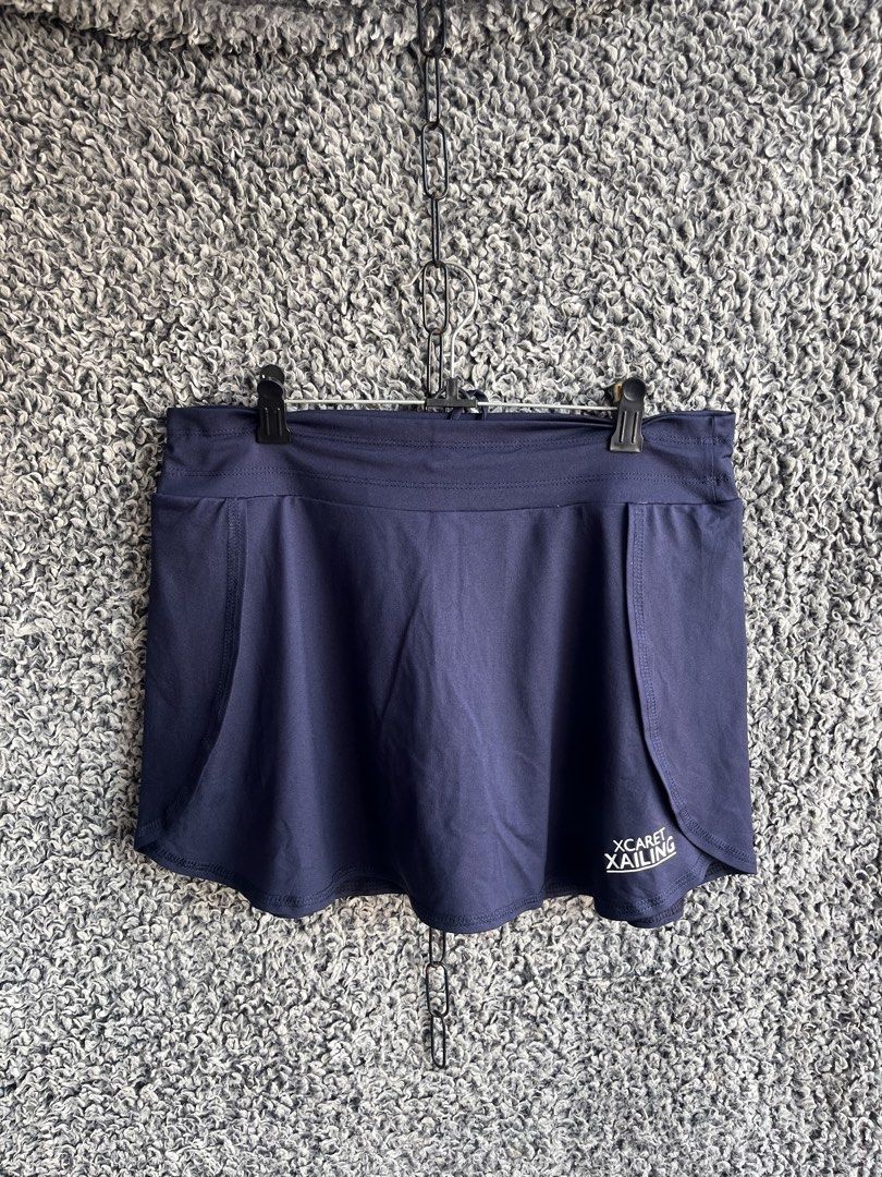 Full Sand navy blue athletic skort | Size L (Category: Skirts) located in General Trias. Submitted by zrchustle.604 (Listing ID 1468281521, Image 1). Description: Full Sand navy blue athletic skort branded with the logo for Xcaret Xailing, which is an official ferry and catamaran excursion service based in Cancun, Mexico. This garment features an overlapping faux-wrap skirt overlay with a rounded dolphin-style hem and an elastic waistband..