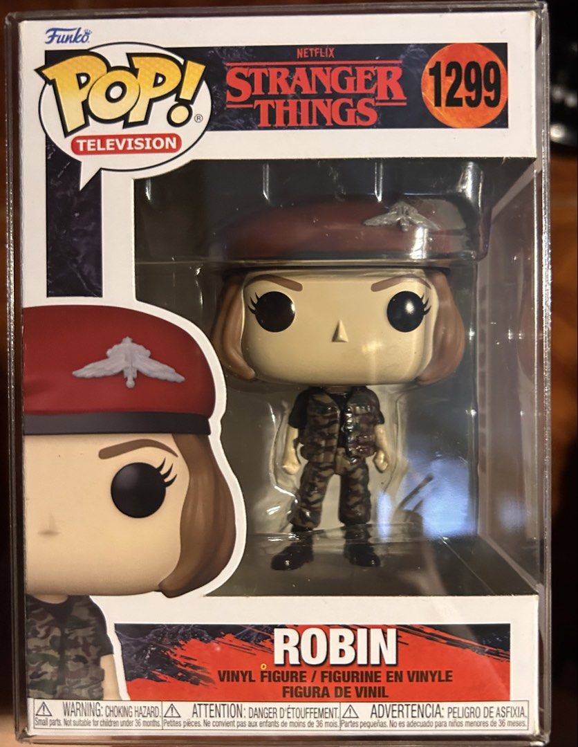 FUNKO POP STRANGER THINGS ROBIN 1299 (Category: Designer & Blind Box Toys) located in Pasig City. Submitted by ssalgnowk (Listing ID 1468133488, Image 1). Description: - Character: Robin from Stranger Things Season 4 (Camouflage uniform with red beret) - Collectible Number: #1299 - Packaging: Comes in original box with clear display window and Netflix branding - Perfect for Funko Pop and Stranger Things collectors - NEVER OUTSIDE OF BOX, dirt due