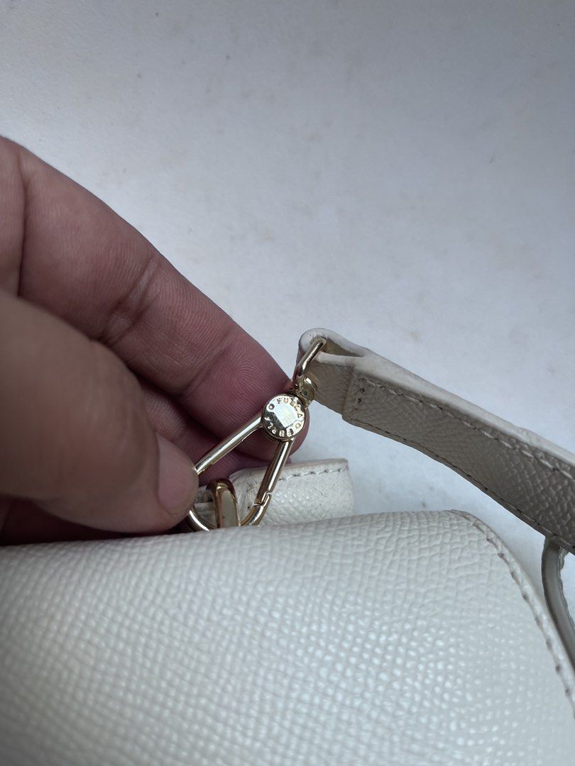 FURLA (Category: Cross-body Bags) located in Dagupan City. Submitted by calmocean-f675cc (Listing ID 1468081857, Image 3). Description: Furla Authentic Good as new With card Color white 2000.