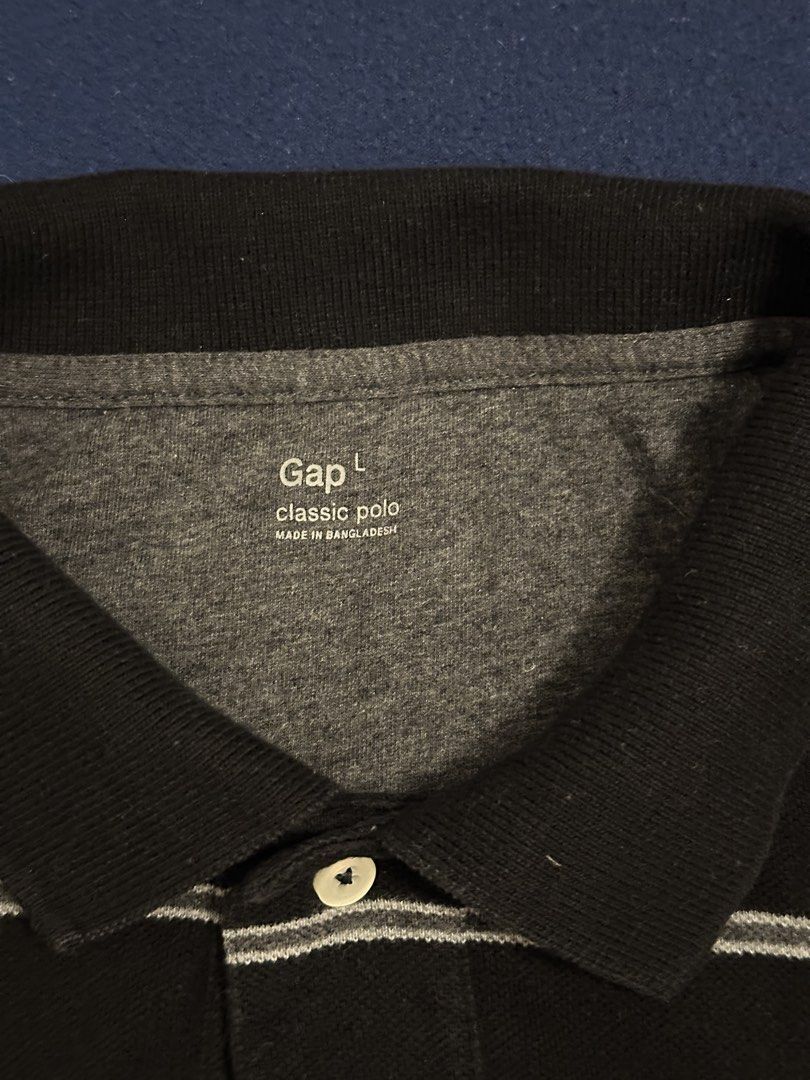 Gap polo shirt (Category: Tshirts & Polo Shirts ) located in Quezon City. Submitted by mancave_stuff (Listing ID 1468186680, Image 3). Description: Gap Black polo shirt Size L: 20” x 28” Black with white stripes Honeycomb fabric Color rate 8/10 No issues.